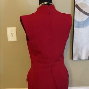 Venus dress faux double breasted look with fake side pockets. Size 4